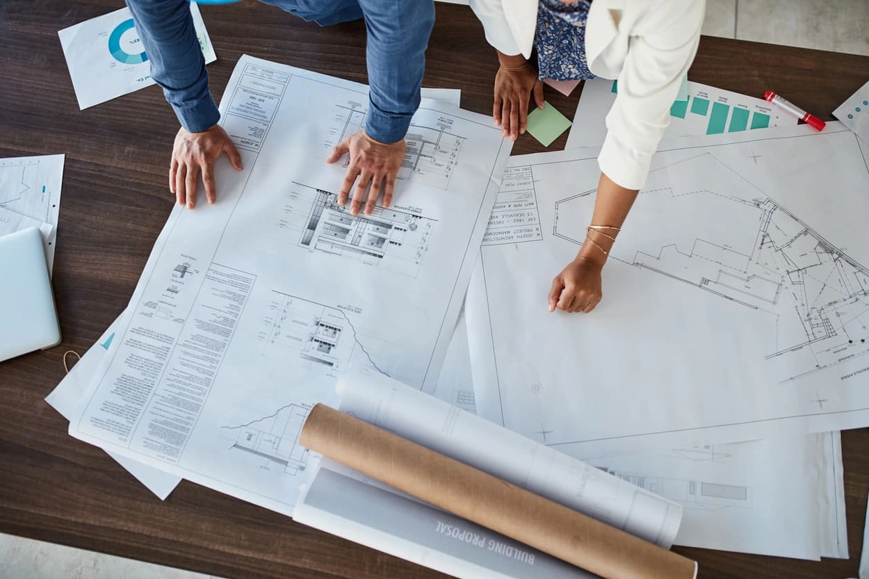 Office team creating more blueprints after purchasing the best cutting plotter in India